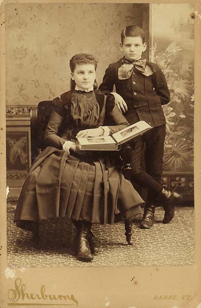 Sherburne - Two Children Looking at a Photo Album