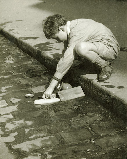 Pierre Auradon - Boy Playing by a Street Curb, Paris