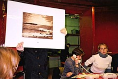 Typical French auction.  Note the way the man is holding up the photograph by Le Gray.