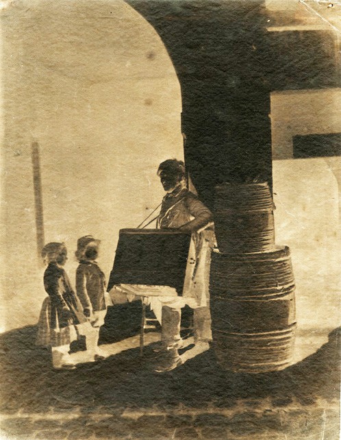 Charles Nègre: Le Joueur d’Orgue (The Organ Grinder and Children). Paper negative, 1853, from the private collection of Alex Novak.